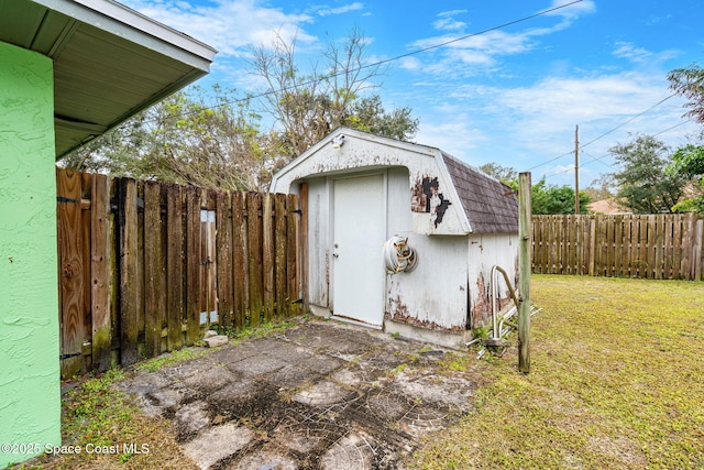 view of outbuilding featuring a yard