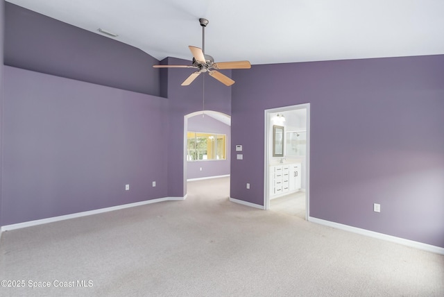 unfurnished room with lofted ceiling, ceiling fan, and light colored carpet