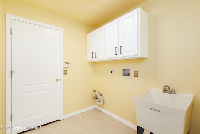 washroom featuring sink, cabinets, hookup for an electric dryer, and washer hookup