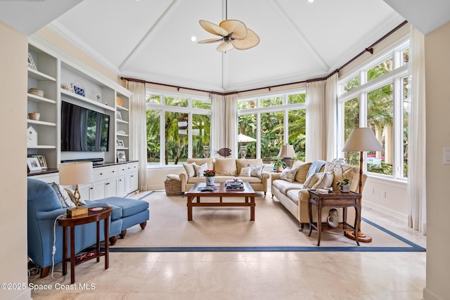 living room with lofted ceiling, ceiling fan, a wealth of natural light, and built in features