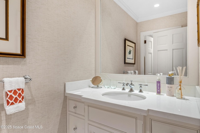 bathroom featuring crown molding and vanity