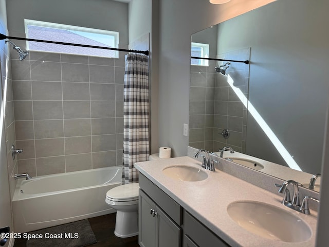 full bathroom featuring vanity, toilet, and shower / bath combo with shower curtain