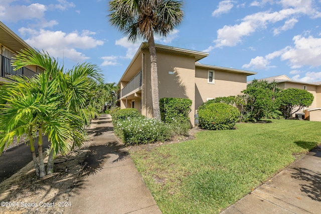 view of home's exterior with a yard