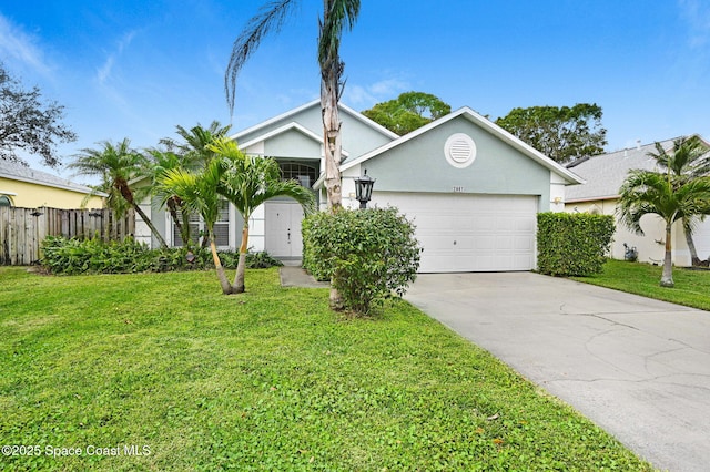 view of front of house featuring a garage and a front lawn