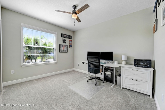 office area with ceiling fan and light colored carpet