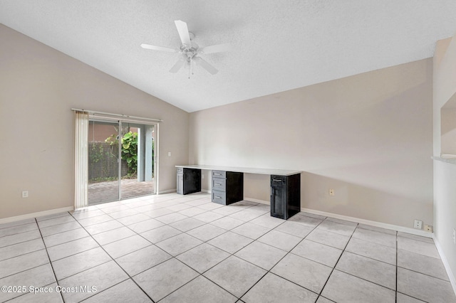 unfurnished living room with lofted ceiling, a textured ceiling, ceiling fan, and light tile patterned flooring