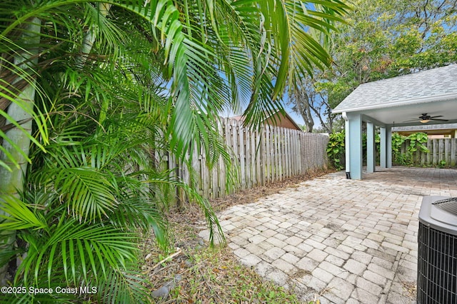 view of patio with ceiling fan and cooling unit