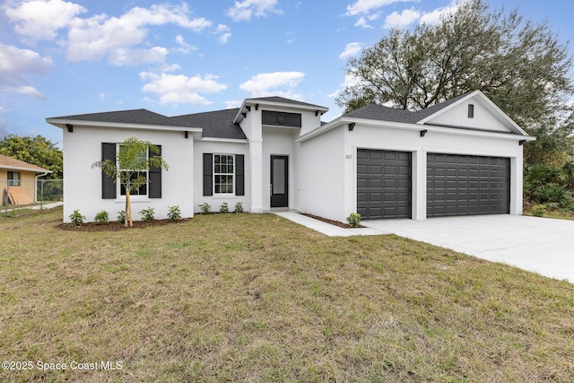 view of front of house with a garage and a front lawn