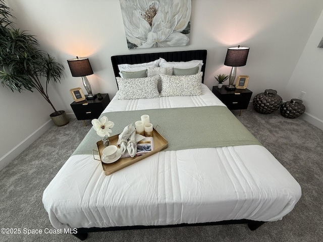bedroom with baseboards and carpet