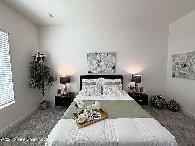 bedroom with baseboards, multiple windows, and carpet