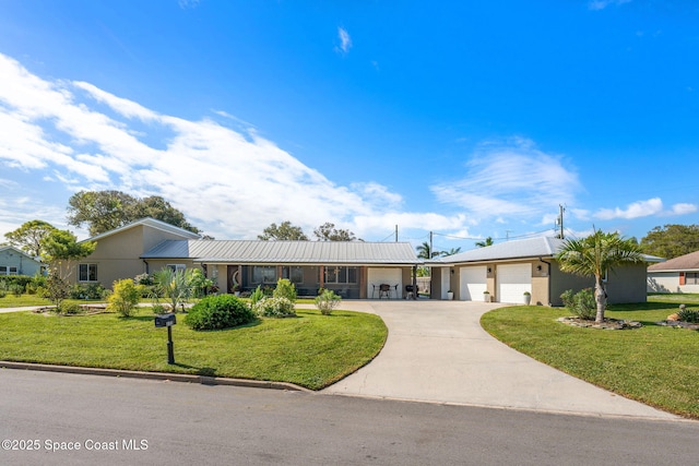 single story home featuring a front lawn and a garage