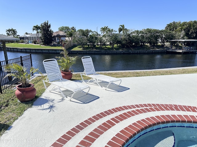 view of patio featuring a water view