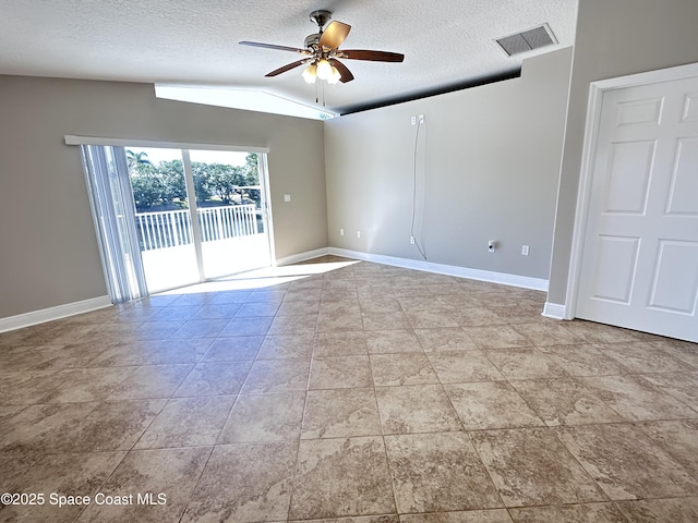 unfurnished room with visible vents, baseboards, and a ceiling fan