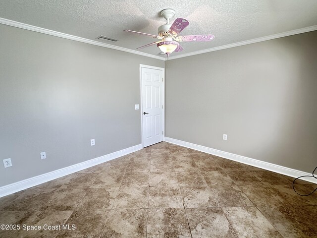 empty room featuring crown molding, a ceiling fan, visible vents, and baseboards