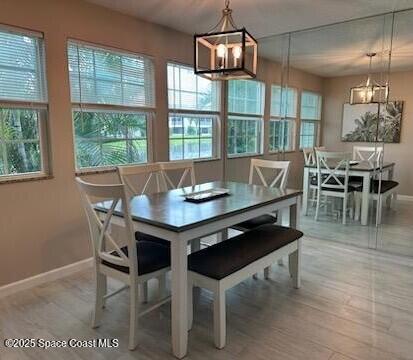 dining space featuring a chandelier