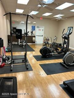 gym with hardwood / wood-style flooring