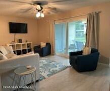 living room with ceiling fan