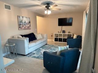 living room featuring ceiling fan