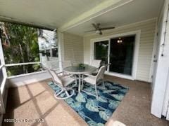 sunroom with ceiling fan