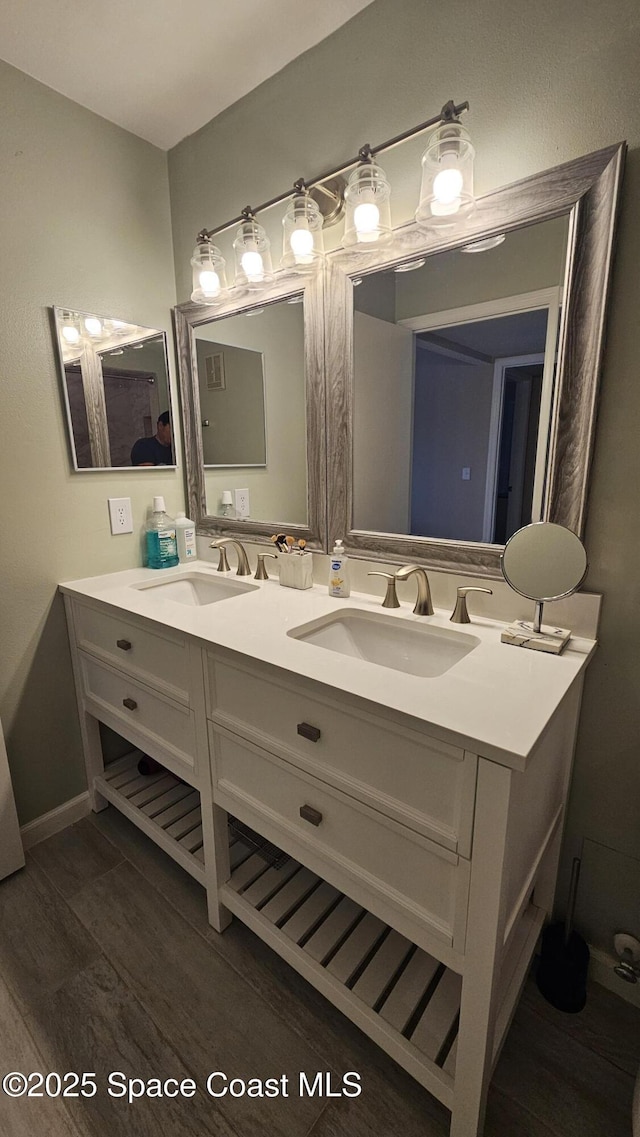 bathroom with wood-type flooring and vanity