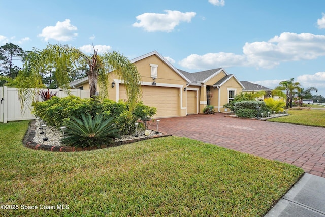 single story home featuring a garage and a front yard