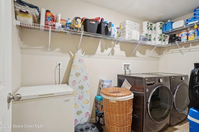 laundry room featuring washer and clothes dryer