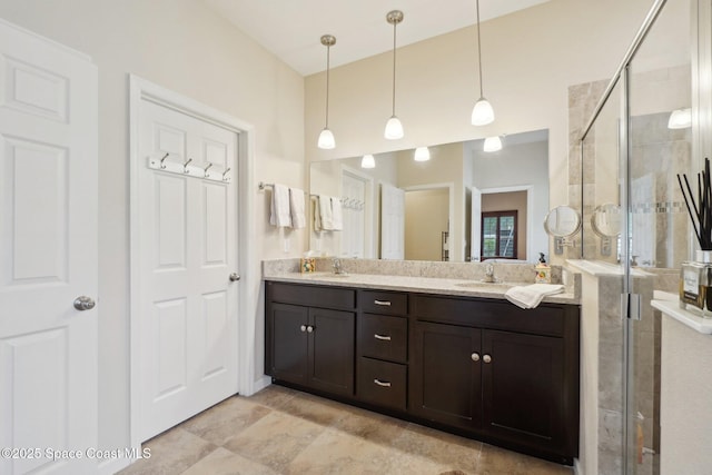 bathroom featuring vanity and a shower with door