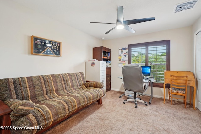 office featuring ceiling fan and light colored carpet