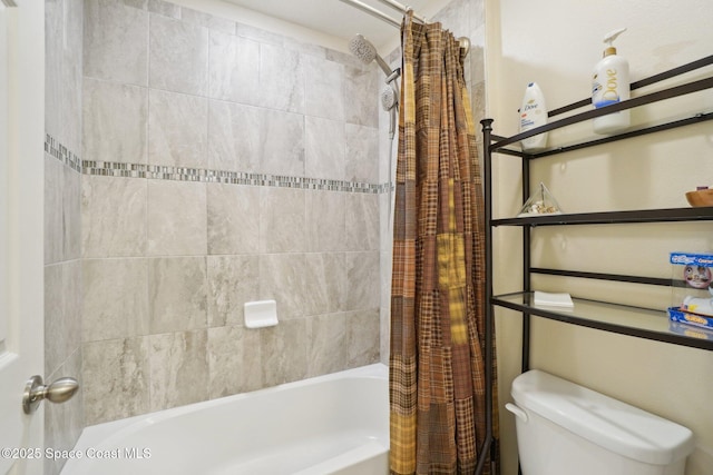 bathroom featuring shower / bath combination with curtain and toilet