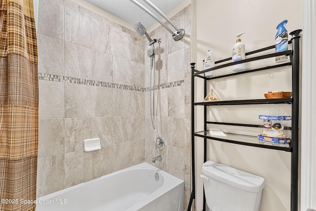 bathroom with shower / tub combo with curtain and toilet