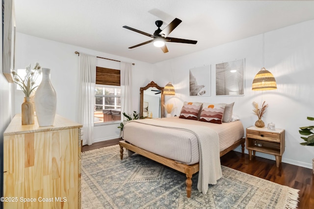 bedroom featuring ceiling fan and dark wood-type flooring