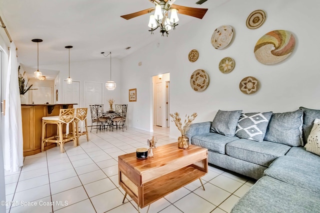 living room with ceiling fan, light tile patterned flooring, and high vaulted ceiling