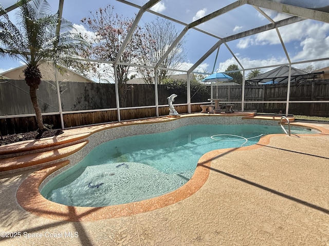 view of pool featuring a patio, a fenced backyard, a fenced in pool, and a lanai