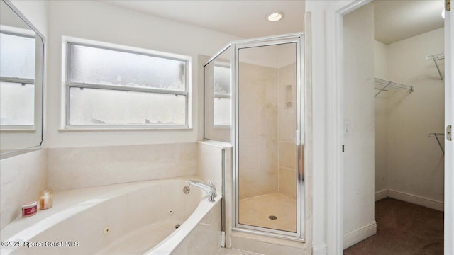 bathroom featuring separate shower and tub