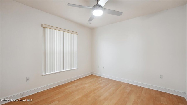 spare room featuring ceiling fan and light hardwood / wood-style flooring