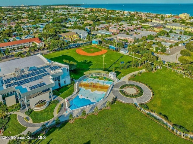 drone / aerial view with a water view and a residential view