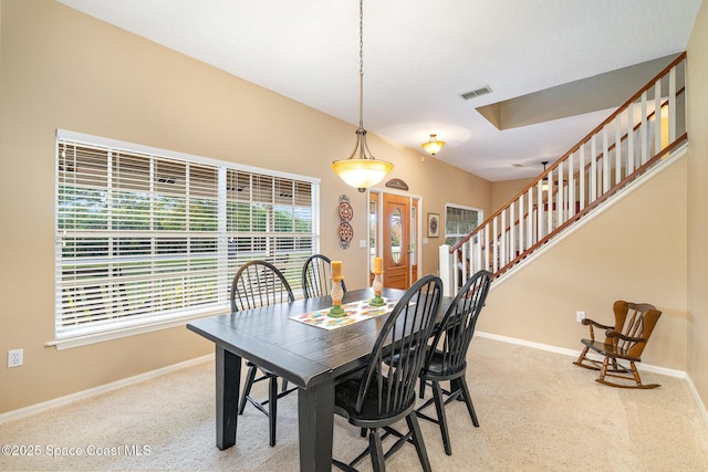 dining space with carpet