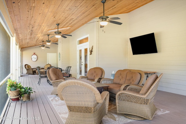 deck featuring french doors, ceiling fan, and an outdoor living space