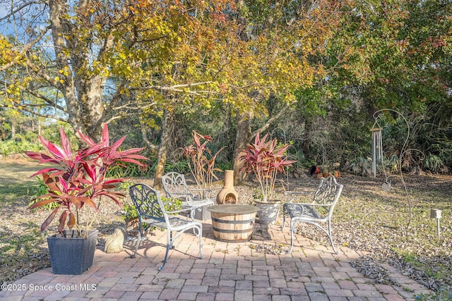 view of patio / terrace featuring a fire pit