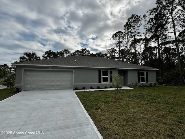 ranch-style house featuring a garage and a front yard