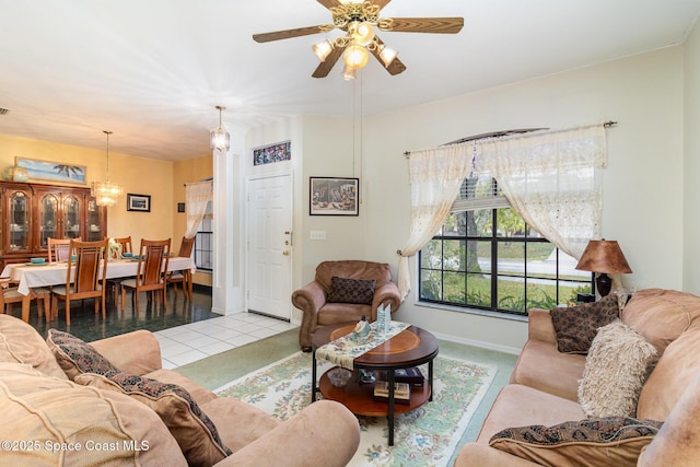 living room featuring ceiling fan and light tile patterned flooring