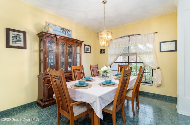 dining space with a chandelier