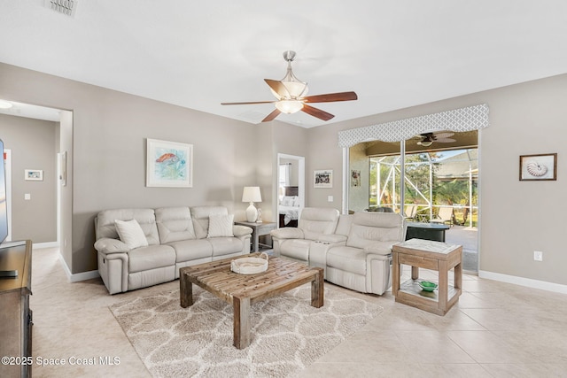 living room featuring ceiling fan and light tile patterned floors