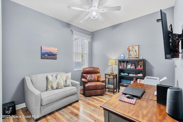 office area featuring ceiling fan and hardwood / wood-style flooring