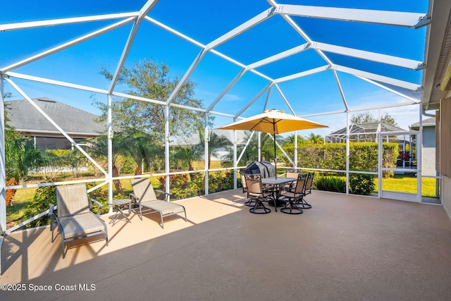 view of patio with glass enclosure