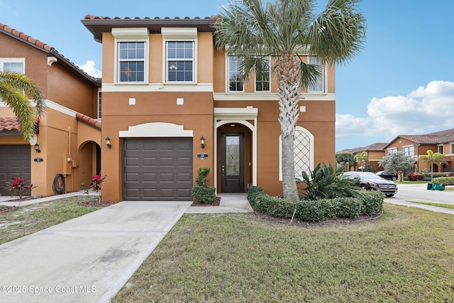 view of front of house featuring a front yard and a garage