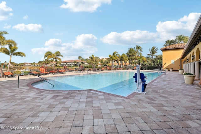 view of swimming pool with a patio area