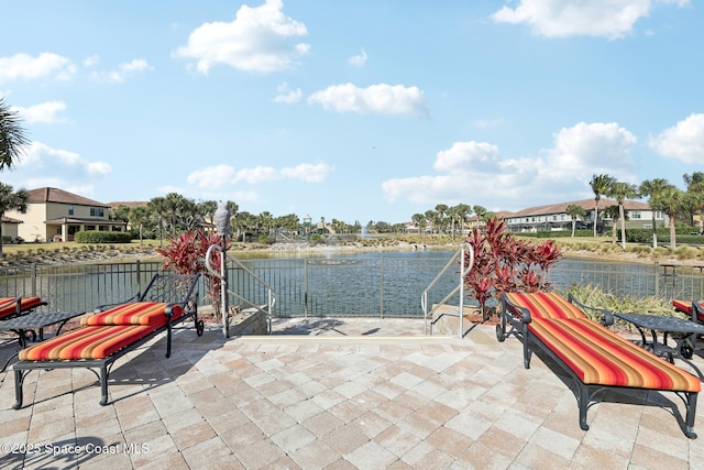 view of patio / terrace with a water view