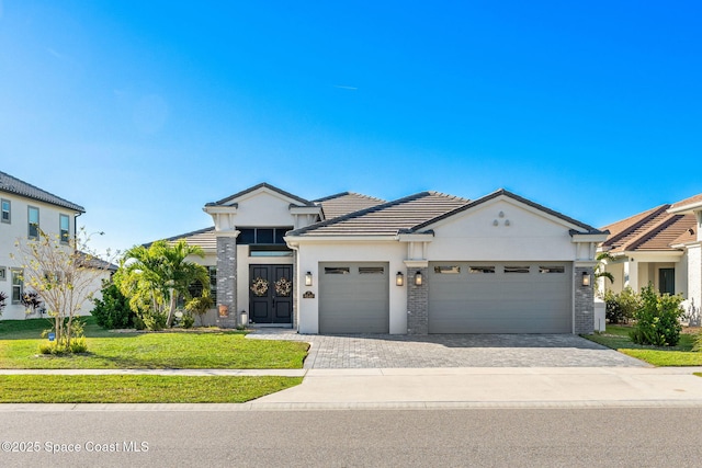 view of front facade featuring a garage and a front lawn