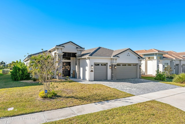 view of front facade with a garage and a front yard